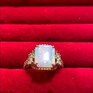 Fire opal stone on a triple plated Rhodium band